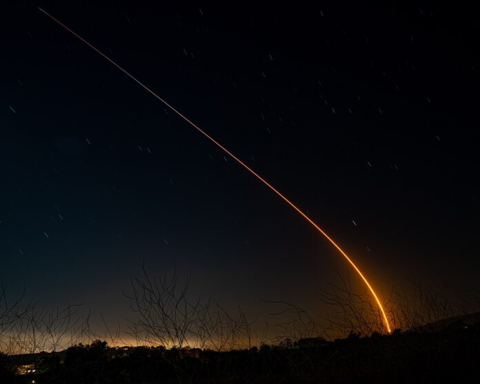 SpaceX Falcon 9 rocket launching a batch of Starlink satellites into the sky