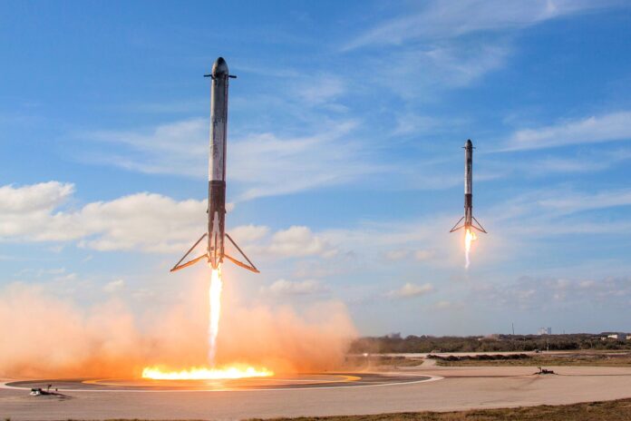 Falcon Heavy side boosters landing at LZ-1 and LZ-2 (2018) Two SpaceX Falcon Heavy side boosters landing side by side at Landing Zones 1 and 2, Cape Canaveral, February 2018