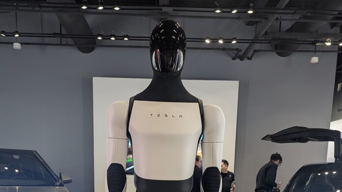 Tesla Optimus humanoid robot on display at a Tesla showroom
