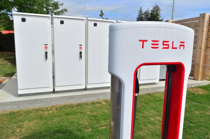 Tesla Powerpack battery storage Tesla Powerpack battery storage cabinets installed next to a Tesla Supercharger station