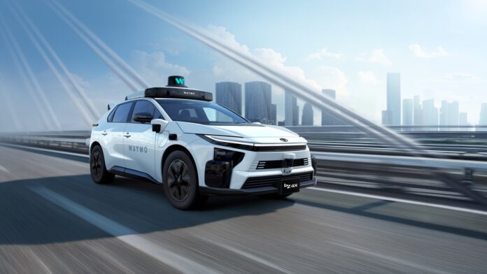 Toyota bZ4X autonomous vehicle for Waymo's ride-hailing service White Toyota bZ4X robotaxi with Waymo roof sensor dome and Waymo lettering driving on an elevated highway with a city skyline behind
